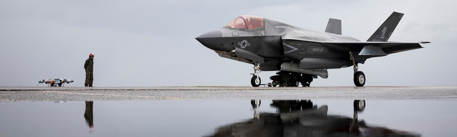 KADENA AIR BASE, OKINAWA, JAPAN - U.S. Marines with Marine Fighter Attack Squadron 121 load ordnance onto an F-35B Lightning II aircraft at Kadena Air Base, Okinawa, Japan, Feb. 2, 2022. Marines with VMFA-121 and Marine Aviation Logistics Squadron 12 conducted annual unit level training and practiced loading ordnance onto F-35B Lightning II aircraft, increasing capability while reducing time on the ground. (U.S. Marine Corps photo by Cpl. Jackson Ricker)