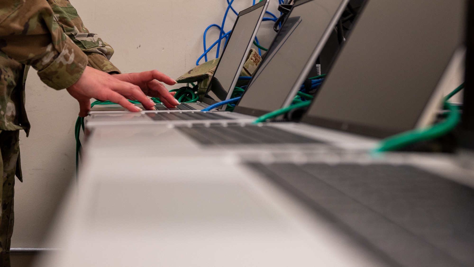 Staff Sgt. Samantha Shupe installs programs on new computers for the 8th Fighter Wing.