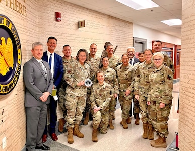 Air Force Col. Dr. Lidia Ilcus, center holding plaque, stands with members of the National Guard Bureau Space Operations staff after a seminar on space medicine as part of the Aldebaran Lecture series at the Pentagon. Ilcus touched on the role of medical operations in both astronaut and Earth-based space mission sets during the January 2024 event.