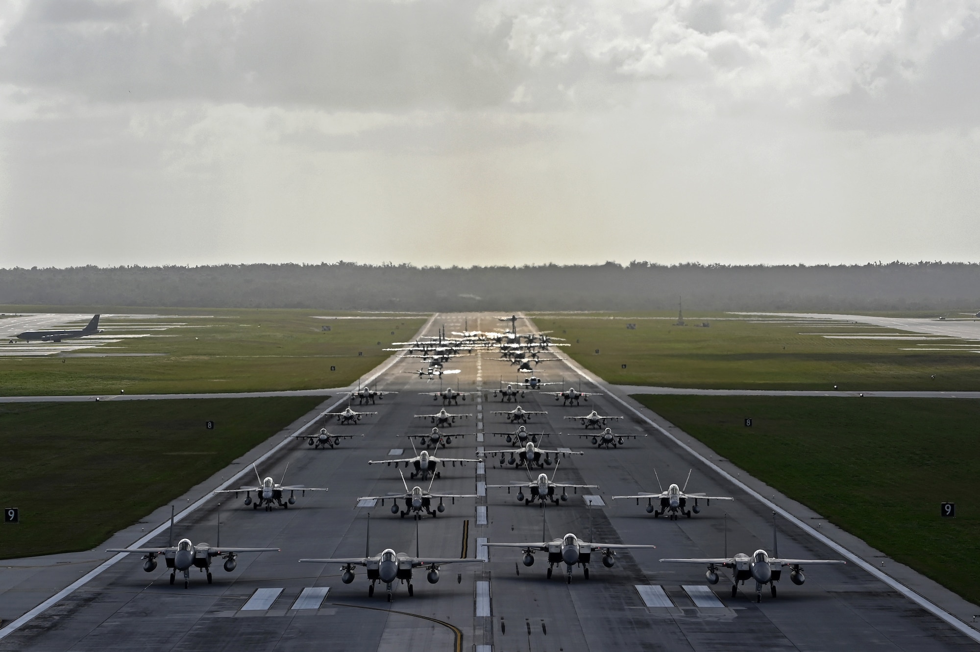 Photo of a multinational elephant walk at Andersen Air Force Base