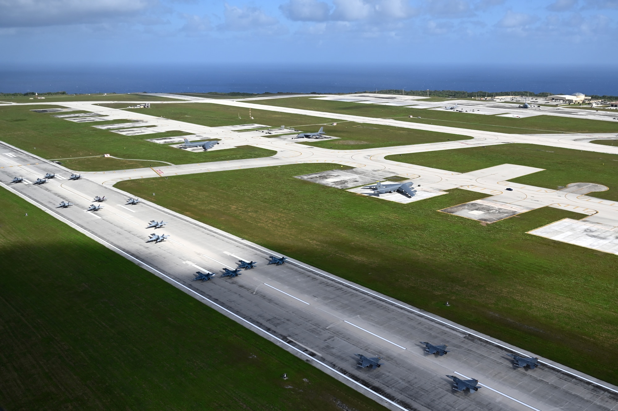 Photo of a multinational elephant walk at Andersen Air Force Base