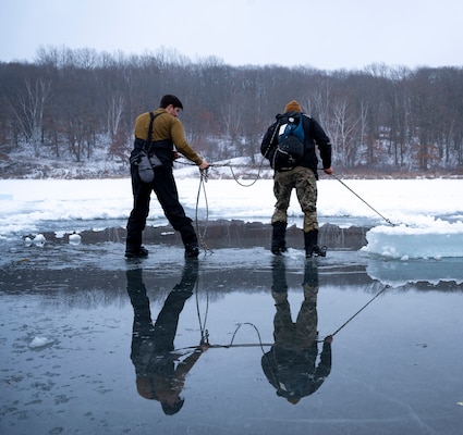 LITTLE FALLS, Minn. (Jan. 25, 2024) – U.S. Navy Divers assigned to Mobile Diving and Salvage Unit (MDSU) 2 prepare to dive in simulated Arctic waters during Snow Crab Exercise 24-1. SNOWCRABEX is an annual exercise designed to test and evaluate U.S. Navy EOD and Navy Diver’s capabilities and equipment in a simulated arctic environment and improve combat effectiveness. Navy EOD and Navy Divers are part of the Navy Expeditionary Combat Force (NECF), enabling the U.S. Navy Fleet by clearing and protecting the battlespace. (U.S. Navy Photo by Mass Communication Specialist 1st Class Jacob D. Bergh/Released)