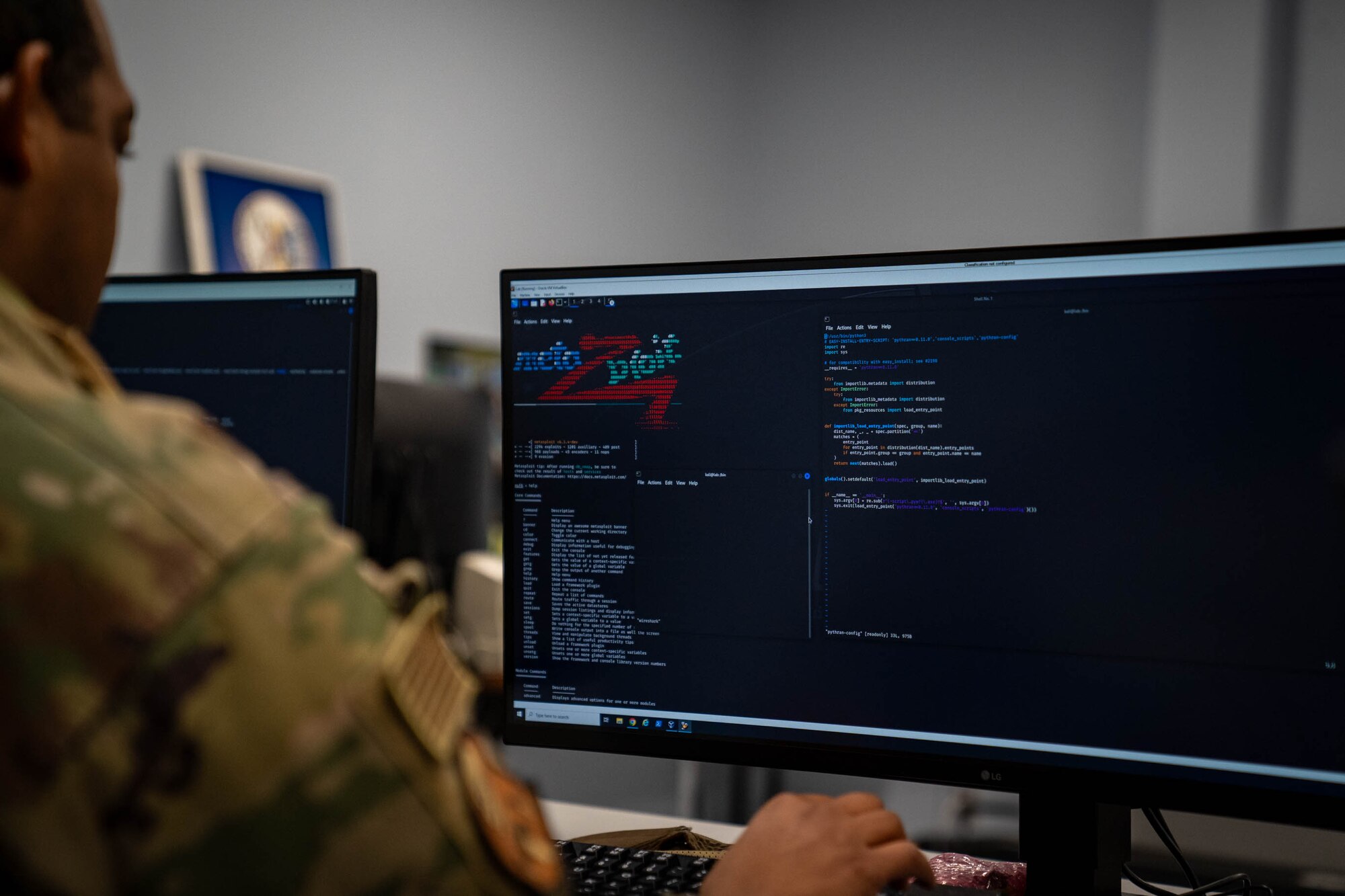 U.S. Air Force Staff Sgt. Alexander Harris, 333rd Training Squadron student, runs commands in the Linux operation system under the instruction of Space Force Sgt. Anastacia Lange, 333rd TRS Cyber Warfare Operator course instructor, at Stennis Hall on Keesler Air Force Base, Mississippi, Jan. 24, 2024.