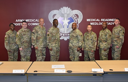 Col. Gary Cooper, center left, and Lt. Col. Nikki Davis, far left, are pictured in an Army Medical Logistics Command command group photo in 2023. Cooper, commander of the U.S. Army Materiel Agency, served as interim AMLC commander for several months, while Davis, USAMMA deputy commander, assumed interim command of USAMMA in Cooper’s stead. USAMMA is one of three direct reporting units to AMLC.