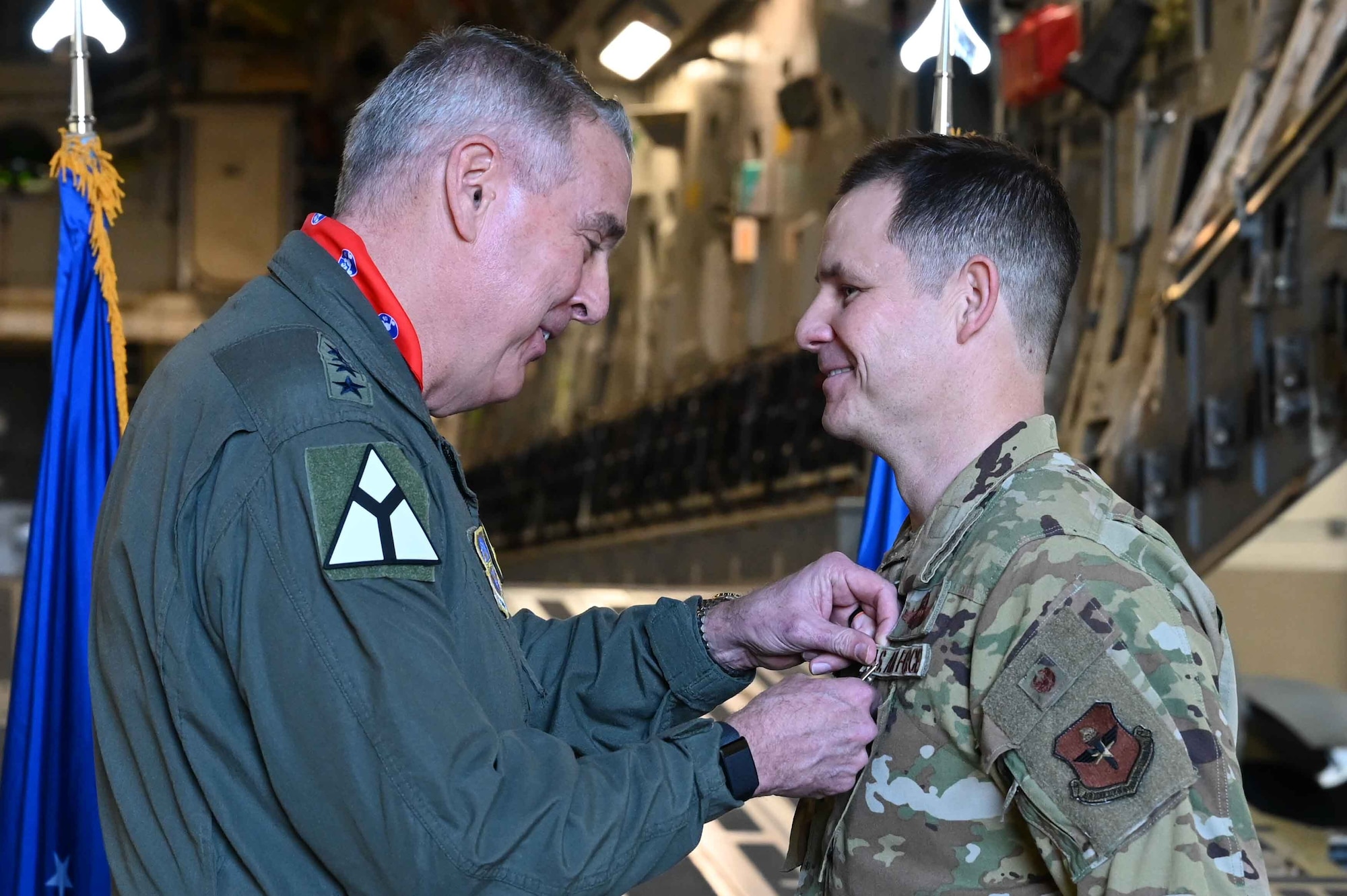 U.S. Air Force Gen. Mike Minihan, Air Mobility Command commander, pins the Bronze Star Medal with Valor on Lt. Col. Patrick McLaughlin, 97th Air Mobility Wing director of staff, at Altus Air Force Base, Oklahoma, Feb. 2, 2024. McLaughlin led the 816th Expeditionary Airlift Squadron in Al Udeid, Qatar, during Operation Allies Refuge in  August 2021. (U.S. Air Force photo by Airman 1st Class Kari Degraffenreed)