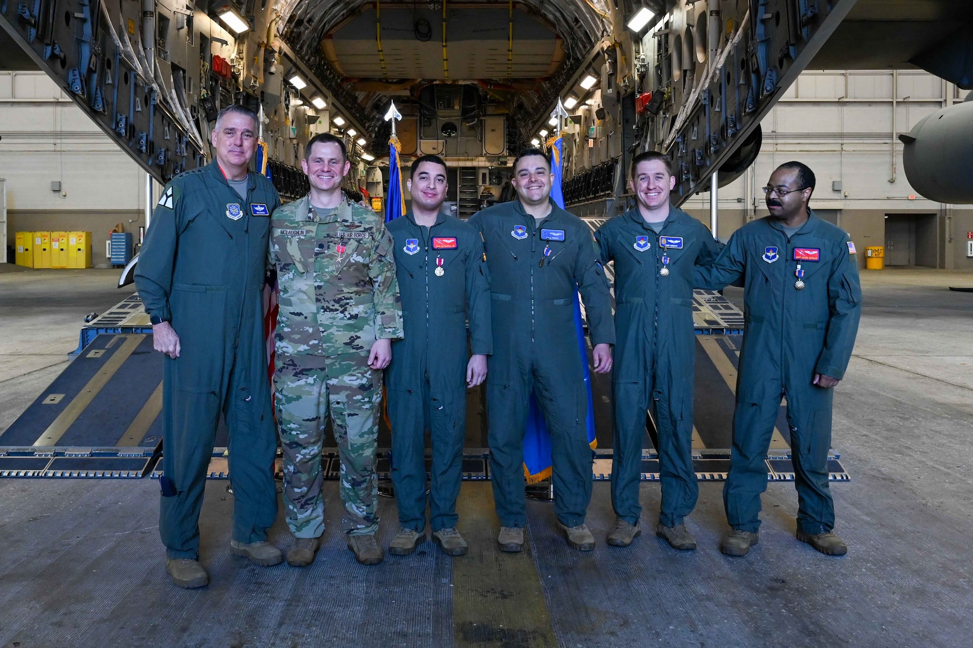 U.S. Air Force Gen. Mike Minihan, Air Mobility Command commander, poses for a photo with Airmen from the 97th Air Mobility Wing at Altus Air Force Base, Oklahoma, Feb. 2, 2024. The Airmen were awarded for their efforts during Operation Allies Refuge, the largest Non-combatant Evacuation Operation airlift in U.S. history. (U.S. Air Force photo by Airman 1st Class Kari Degraffenreed)