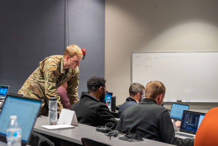 A group of people looking at computers