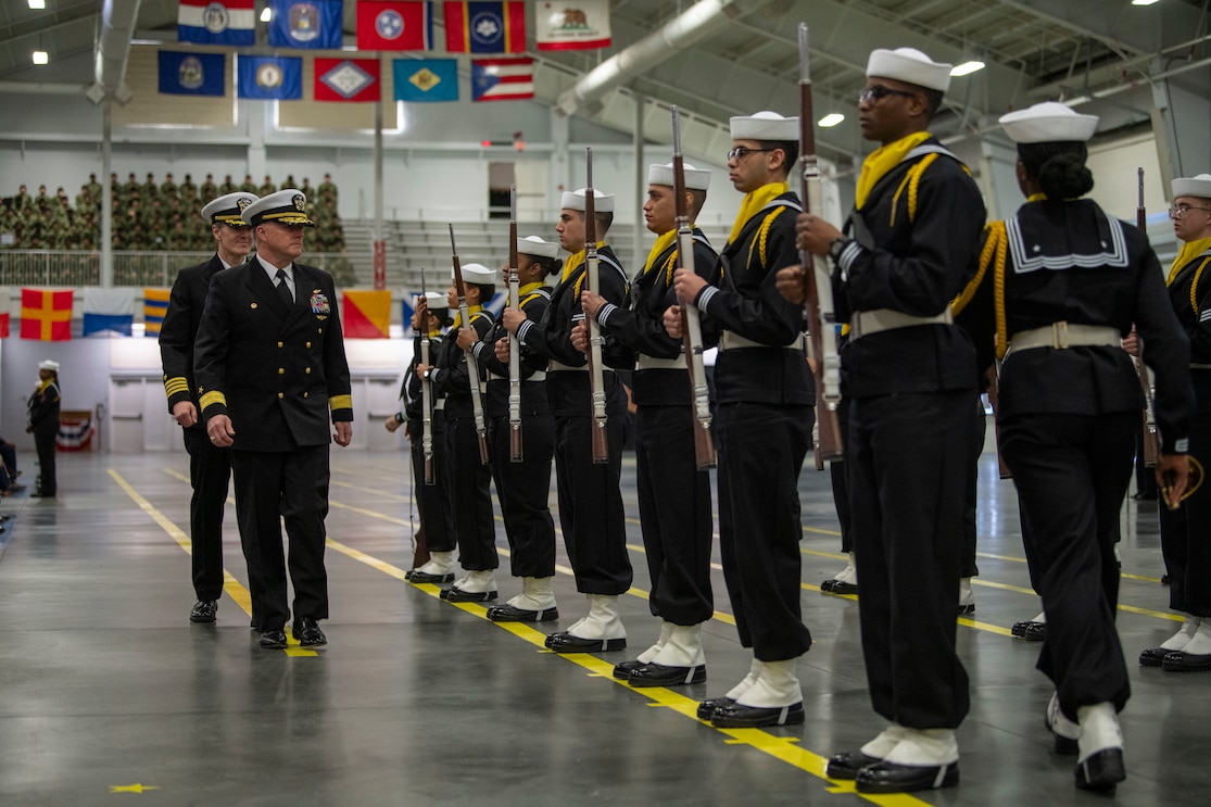 The reviewing officer, Rear Adm. Craig T. Mattingly (front), Commander, Naval Service Training Command, and Capt. Kenneth Froberg, commanding officer, Recruit Training Command (RTC), inspect the newest Sailors at RTC’s Pass-in-Review in Great Lakes, Illinois, Feb. 1, 2024. More than 40,000 Recruits train annually at the Navy's only boot camp (U.S. Navy photo by Mass Communication Specialist 2nd Class Christopher M. O'Grady)