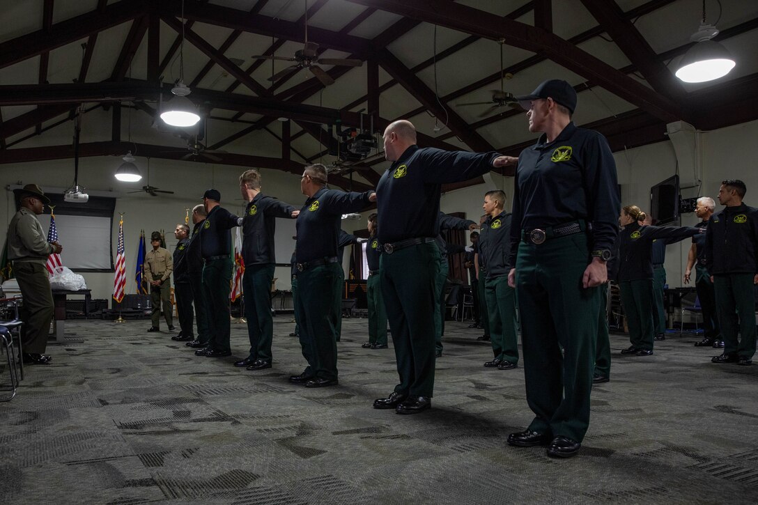 Members of the United States Forest Service Honor Guard practice drill movements with the Marine Corps Recruit Depot San Diego Regiment Color Guard at MCRD San Diego, Feb. 1, 2024. The USFS Honor Guard visited the Depot to promote and reinforce the customs, history, and traditions of the Marine Corps. (U.S. Marine Corps photo by Lance Cpl. Sarah M. Grawcock)