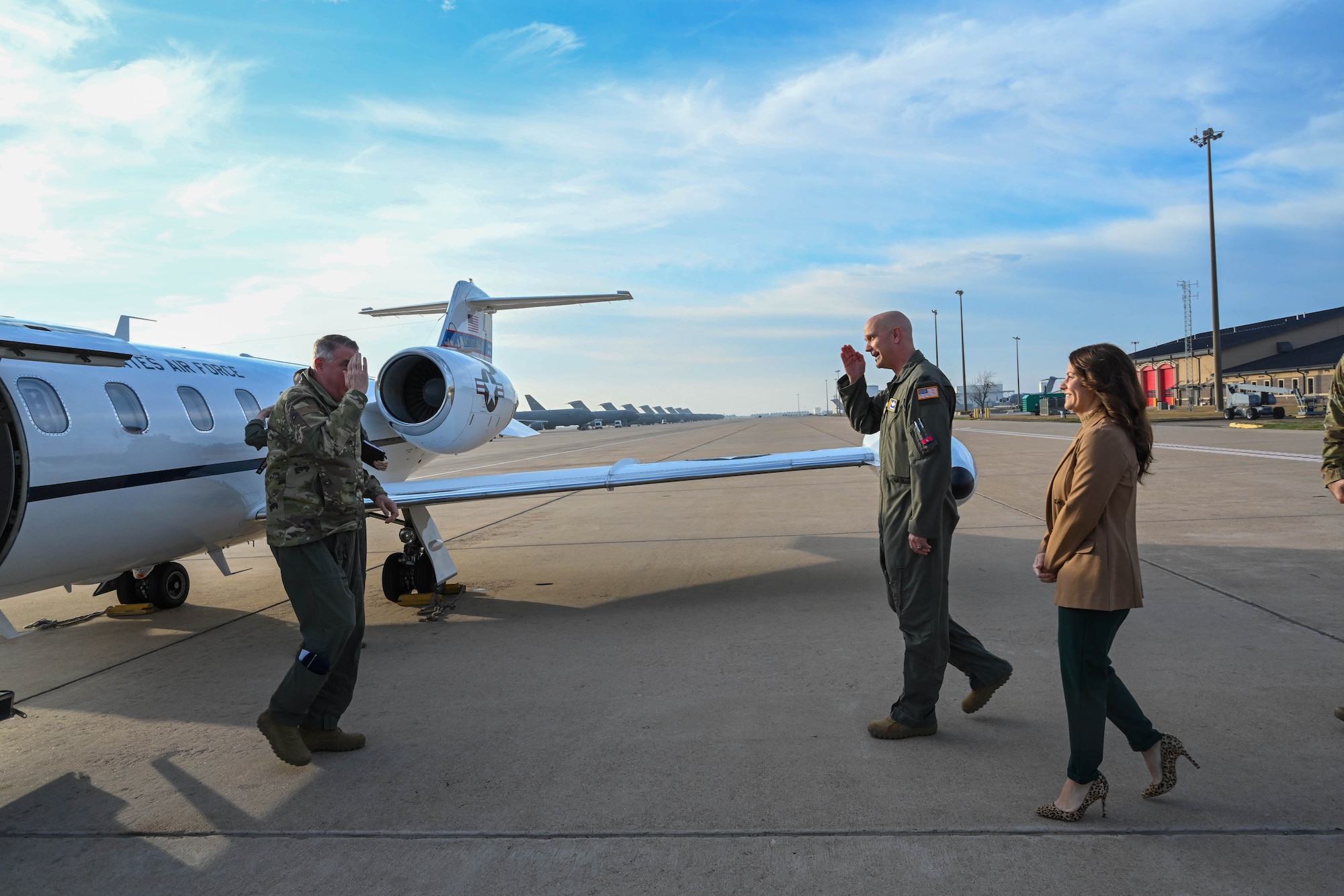 U.S. Air Force Col. Jeff Marshall, 97th Air Mobility Wing commander, salutes Gen. Mike Minihan, Air Mobility Command commander, at Altus Air Force Base, Oklahoma, Feb. 2, 2024. Minihan presented five Airmen with awards for their efforts during Operation Allies Refuge. (U.S. Air Force photo by Senior Airman Miyah Gray)