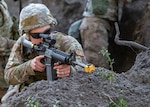 Airman 1st Class Sarah Wilford, 202nd RED HORSE Squadron structural maintenance apprentice, responds to a simulated hostile enemy during the FEBEX24 exercise at Camp Blanding, Florida, Feb. 2, 2024.