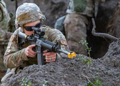 Airman 1st Class Sarah Wilford, 202nd RED HORSE Squadron structural maintenance apprentice, responds to a simulated hostile enemy during the FEBEX24 exercise at Camp Blanding, Florida, Feb. 2, 2024.