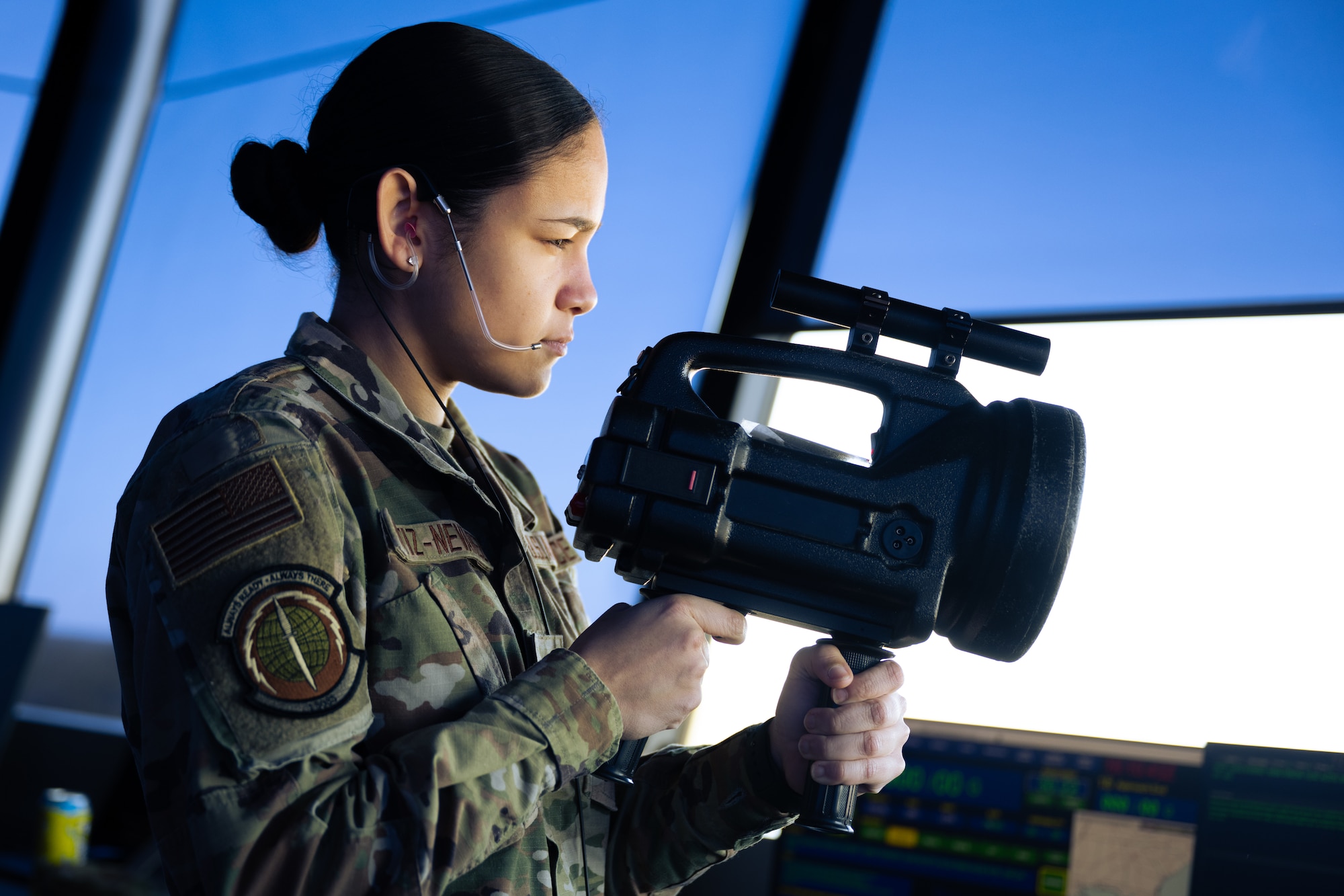 U.S. Air Force Airman 1st Class Shelyann Ortiz-Nevárez, a 1st Special Operations Support Squadron air traffic control journeyman, holds a light gun at the air traffic control tower at Hurlburt Field, Florida, Jan. 30, 2024.
