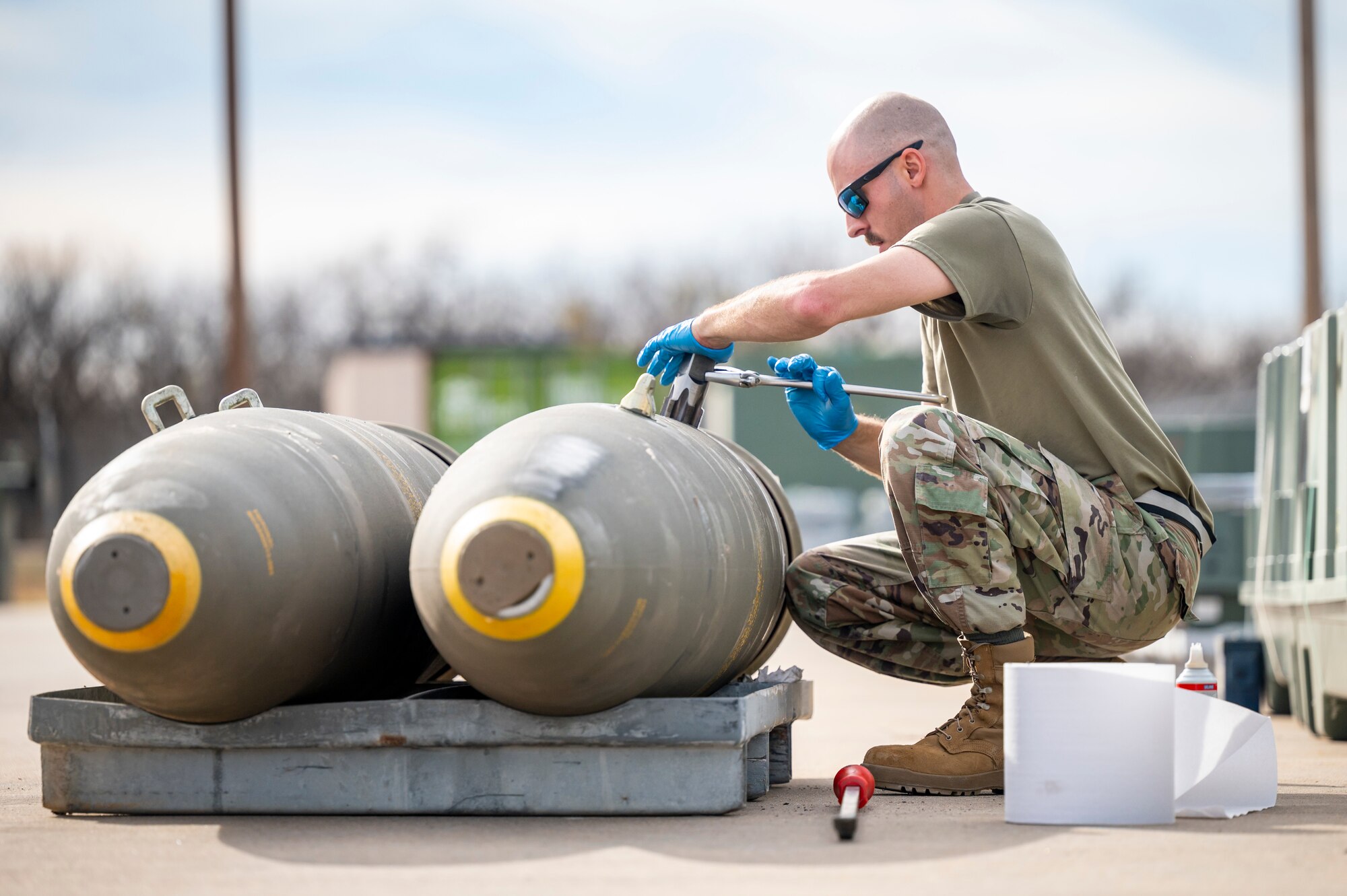 An Airman from the 7th Munitions Conventional Maintenance shop prepares Joint Direct Attack Munitions at Dyess Air Force Base, Texas, Jan. 31, 2024. Ellsworth Air Force Base B-1Bs recently launched from Dyess Air Force Base to support U.S. Central Command priorities, validating the United States Air Force capability to provide precision, long-range strike anytime, anywhere. (U.S. Air Force photo by Senior Airman Leon Redfern)