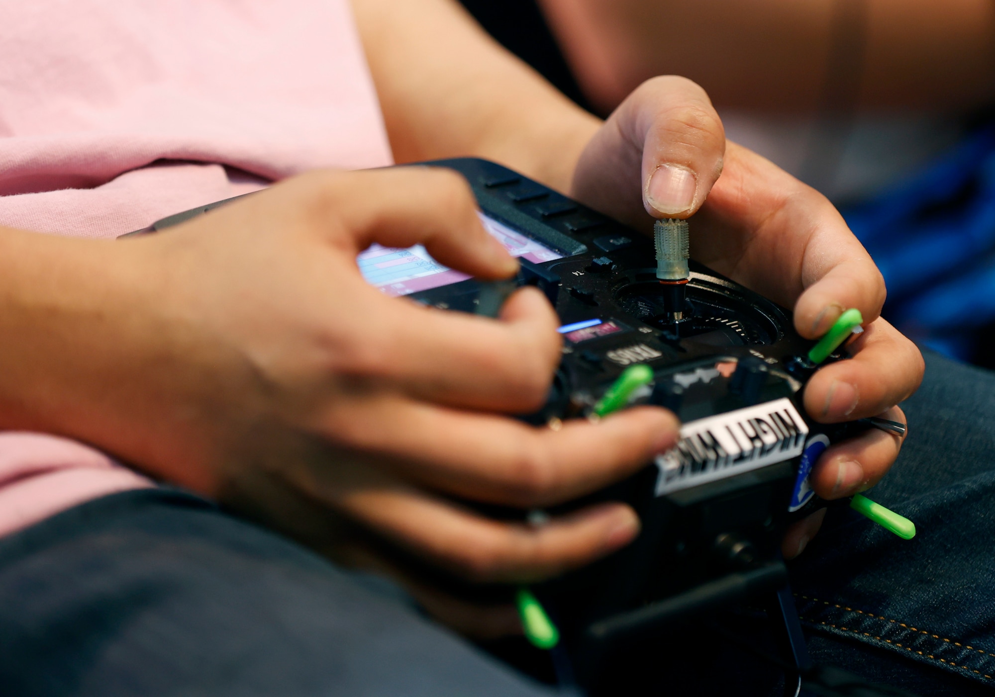 Image of hands on a gaming control