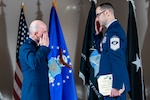 two service members salute each other