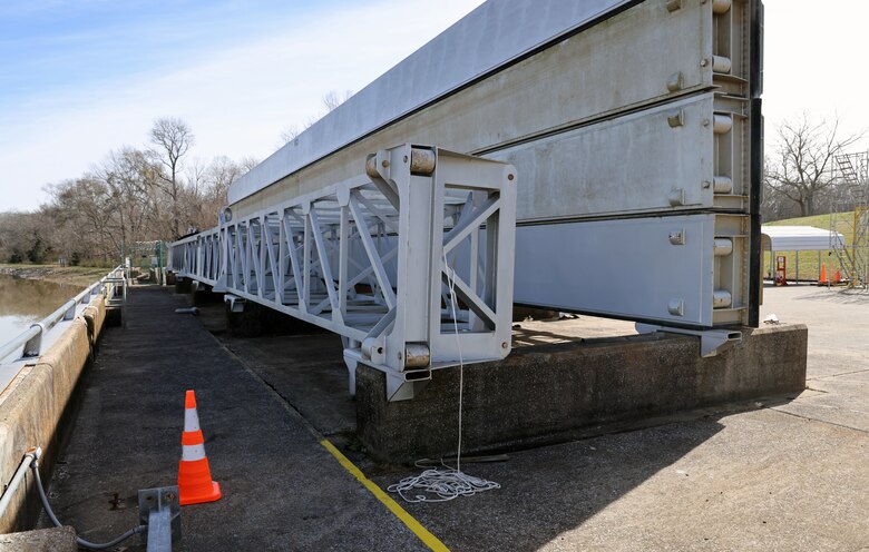 Stop Logs sit by the damaged Demopolis Lock in Demopolis, Alabama, Feb. 1, 2024. The stop logs will be put into the lock to help repair the breach on Jan. 16. The U.S. Army Corps of Engineers Mobile District and partners are working 24/7 to make the lock fully operable for an estimated timeframe of May. (U.S. Army photo by Chuck Walker)