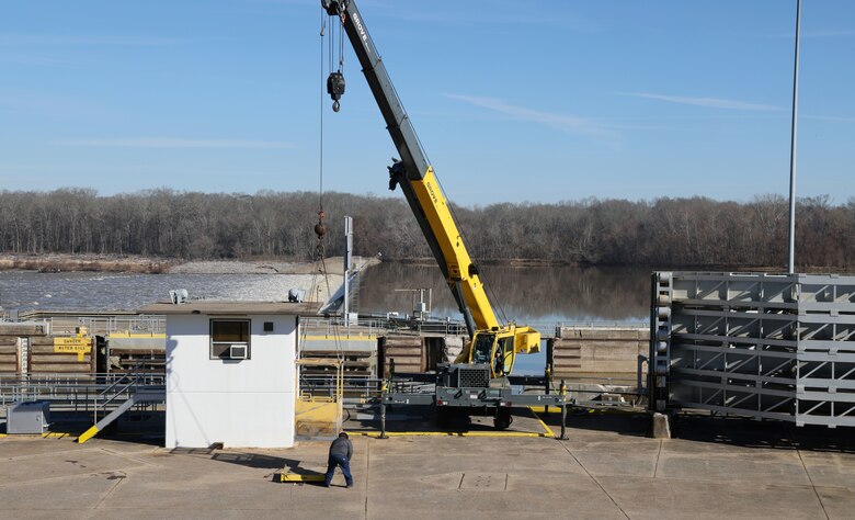 Heavy equipment operators test a crane at the Demopolis Lock and Dam, Demopolis, Alabama, Feb. 2, 2024. The U.S. Army Corps of Engineers Mobile District works 24/7 to repair the Demopolis Lock, which was breached on Jan. 16 and is inoperable until the repairs are finished. (U.S. Army photo by Chuck Walker)