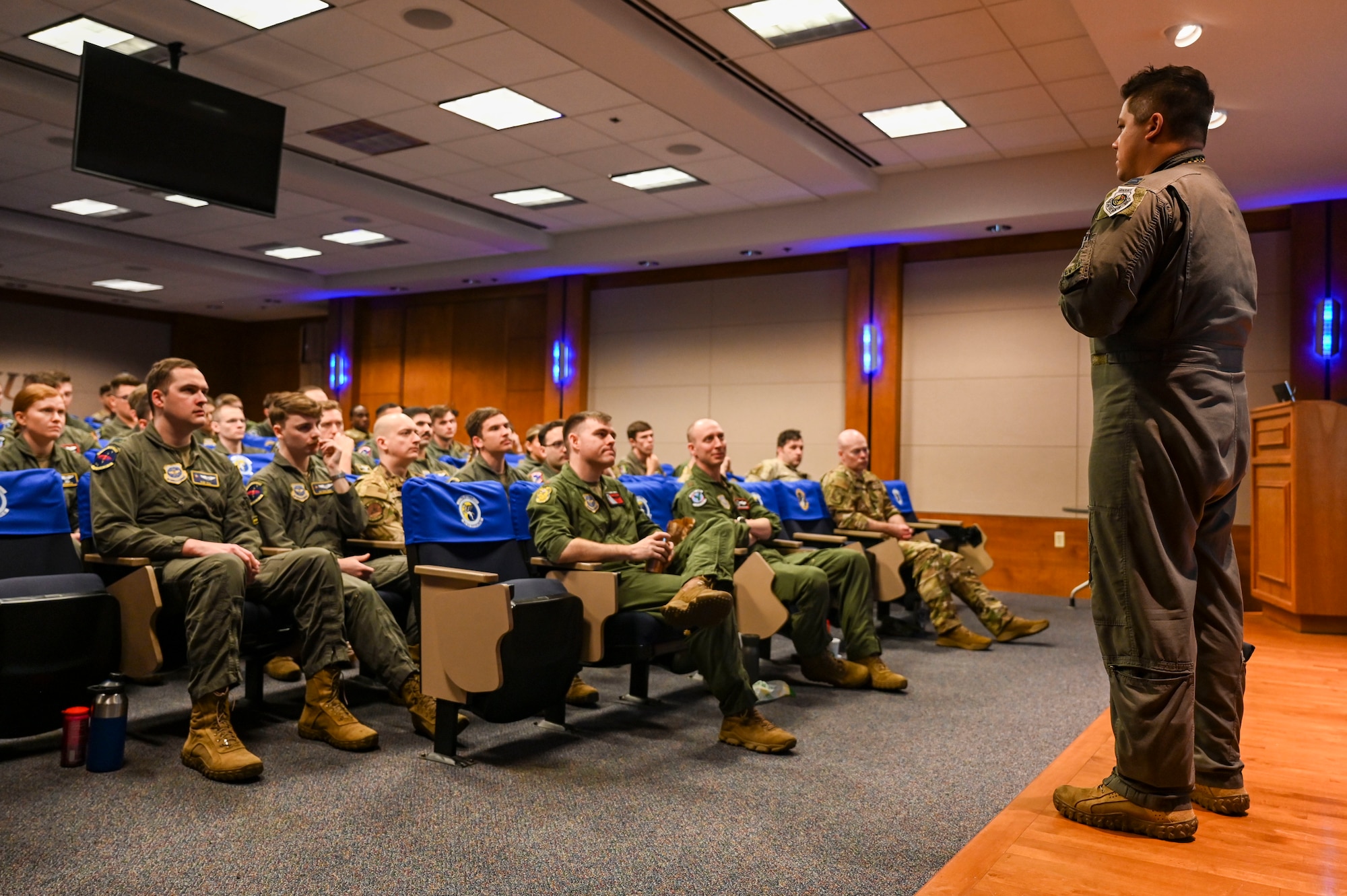Airmen listen during a briefing