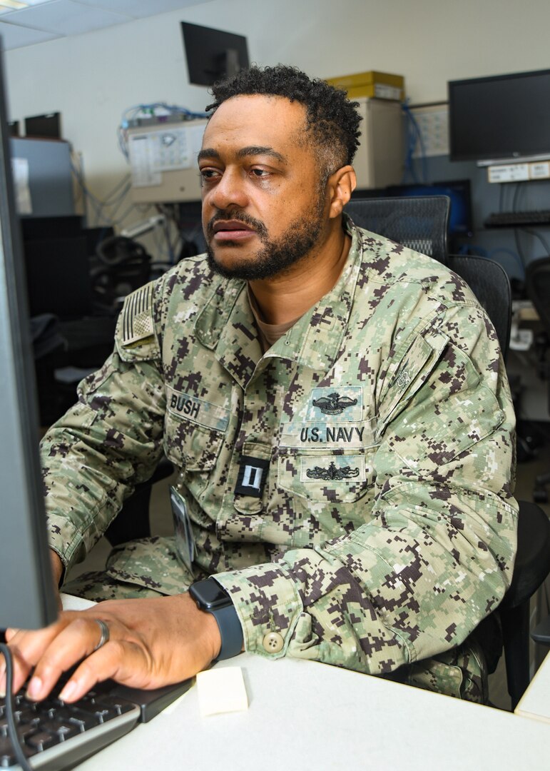 Lt. Kenneth J. Bush is named Navy Medicine's "Junior Information Technology Officer of the Year" for 2023. Bush, shown here in the Information Management Department of Naval Medical center Camp Lejeune on Jan. 25, 2024,  serves as chief information officer with Navy Medicine Readiness and Training Command Camp Lejeune.