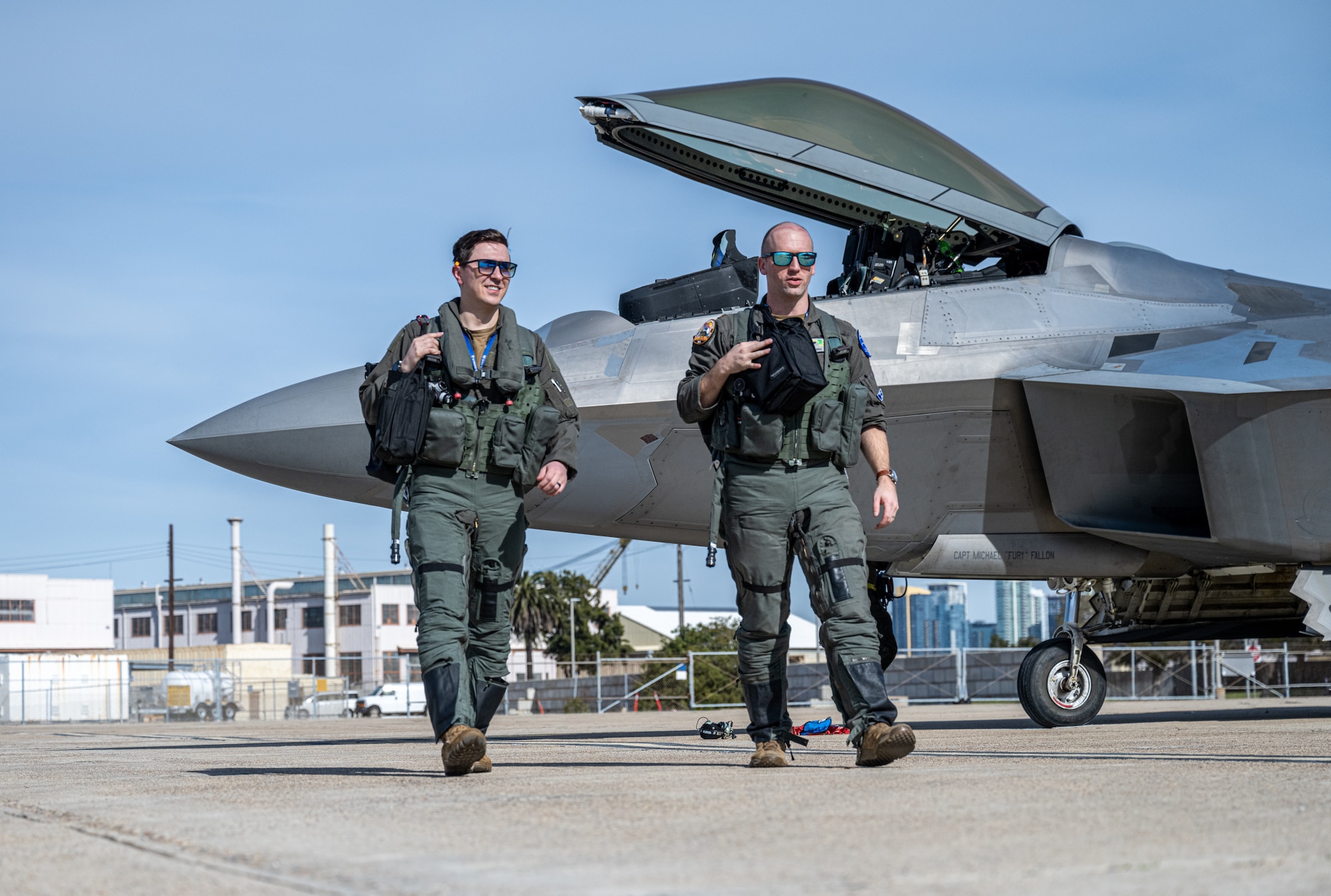 U.S. Air Force Capt. Robert Cabri (left) and U.S. Air Force Maj. Kyle Nazarek, F-22 pilots deployed with the 525th Expeditionary Fighter Squadron, 3rd Air Expeditionary Wing, Joint Base Elmendorf-Richardson, Alaska, arrive in support of Exercise Bamboo Eagle 24-1 at Naval Air Station North Island, California, Jan. 28, 2024.