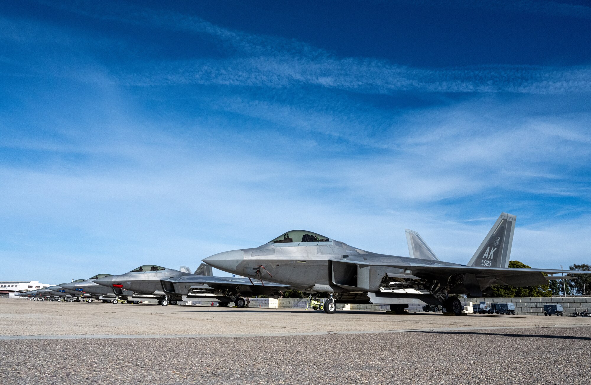 F-22 Raptors deployed under the 525th Expeditionary Fighter Squadron, 3rd Air Expeditionary Wing, Joint Base Elmendorf-Richardson, Alaska, sit on the airfield during Exercise Bamboo Eagle 24-1 at Naval Air Station North Island, California, Jan. 28, 2024.