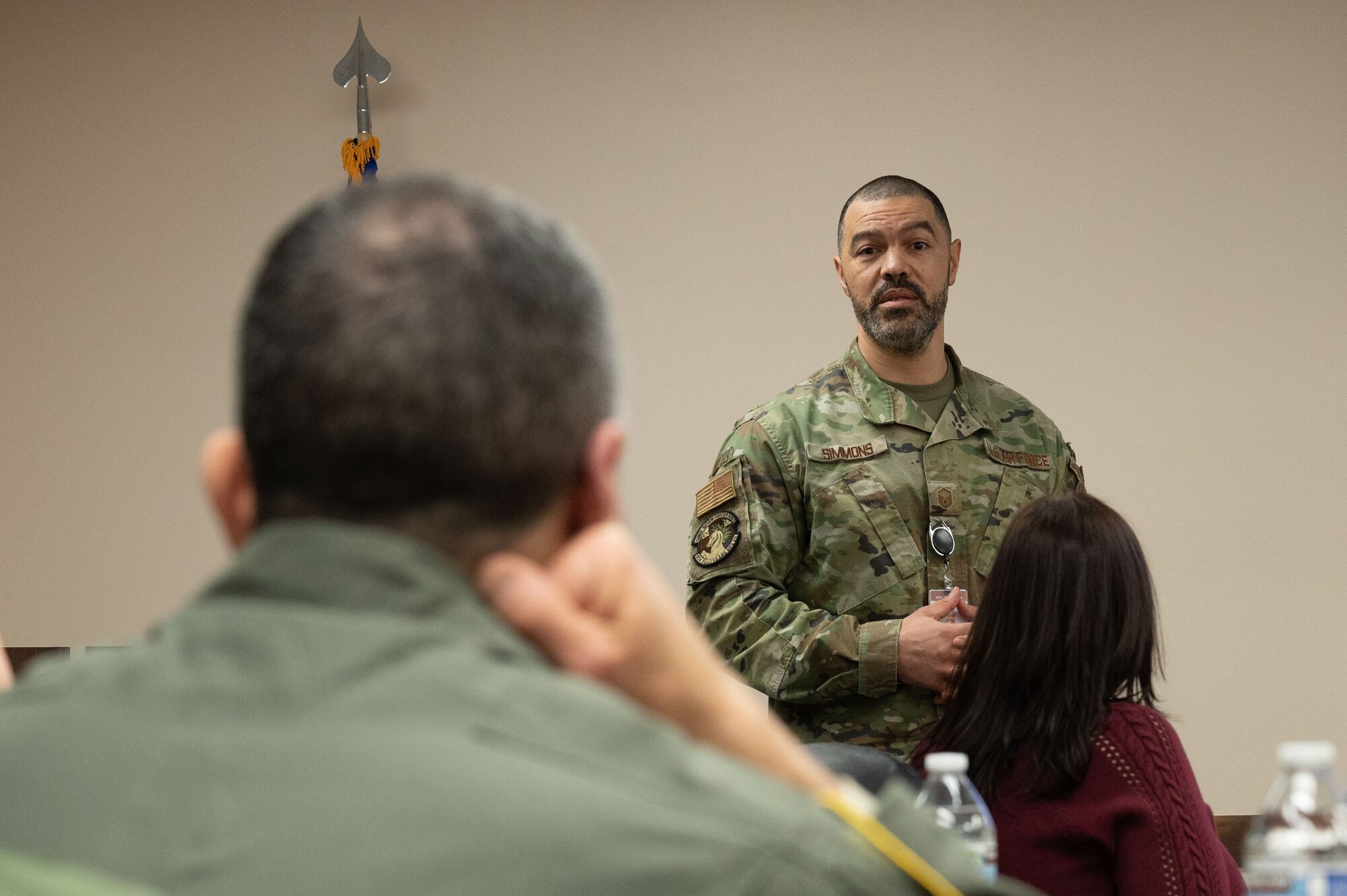 U.S. Air Force Master Sgt. Nicholas Simmons, 354th Medical Group Tricare operations flight chief, briefs Lt. Gen. David Nahom, commander, Alaskan NORAD Region, Alaskan Command and Eleventh Air Force, during a base visit at Eielson Air Force Base, Alaska, Feb. 1, 2024.