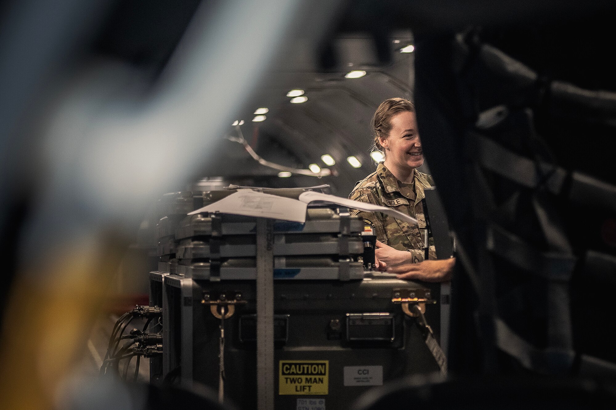 U.S. Air Force Airman 1st Class Darian Engle, 305th Operations Support Squadron combat crew communications technician and Joint Base McGuire-Dix-Lakehurst Bamboo Eagle 24-1 Top Performer, assists the operation of a Roll-on Beyond Line-of-Sight Enhancement kit aboard a KC-46A Pegasus from the 2nd Air Refueling Squadron at Travis Air Force Base, Calif., Jan. 27, 2024. A ROBE is a self-contained communications suite that advances access to user gateways more efficiently to further combat effectiveness. (U.S. Air Force photo by Staff Sgt. Austin Knox)