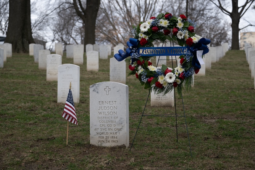 A wreath by a gravesite.