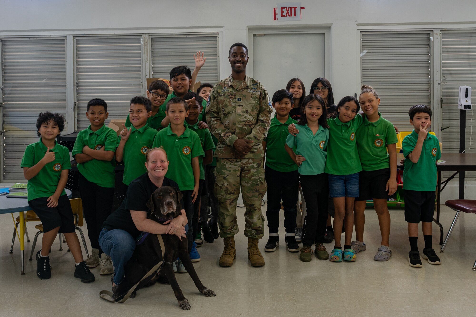 Photo of a Guardian posing with a class
