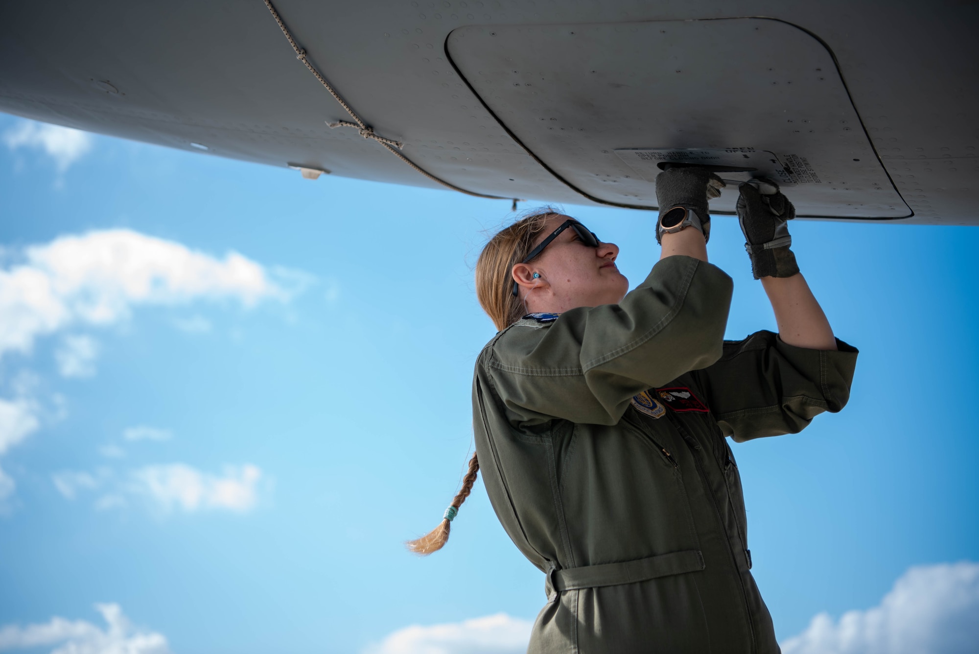 pilot checks the outside of the plane