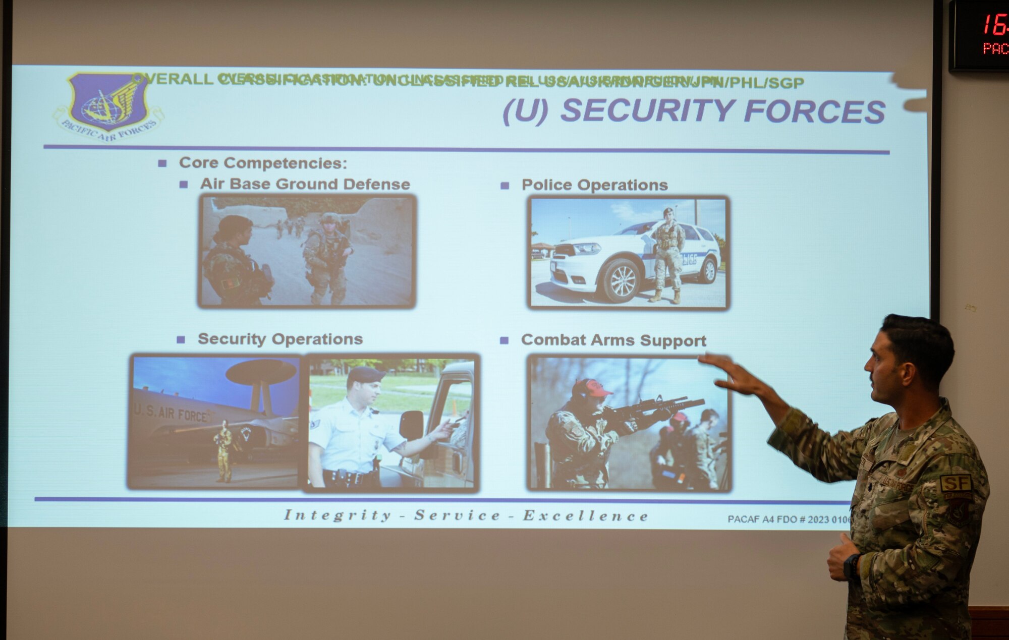 U.S. Air Force Lt. Col. Marc Stanco, commander of the 647 Security Forces Squadron, Joint Base Pearl Harbor-Hickam, Hawaii, facilitates the opening brief for the Security Forces Key Leader Engagement meeting during Pacific Defender at Andersen Air Force Base, Guam, Jan. 30, 2024. The purpose of the KLE meeting is to enhance interpersonal relationships among attendees, and provide networking opportunities for multilateral partnerships and allies. (U.S. Air Force photo by Airman 1st Class Audree Campbell)