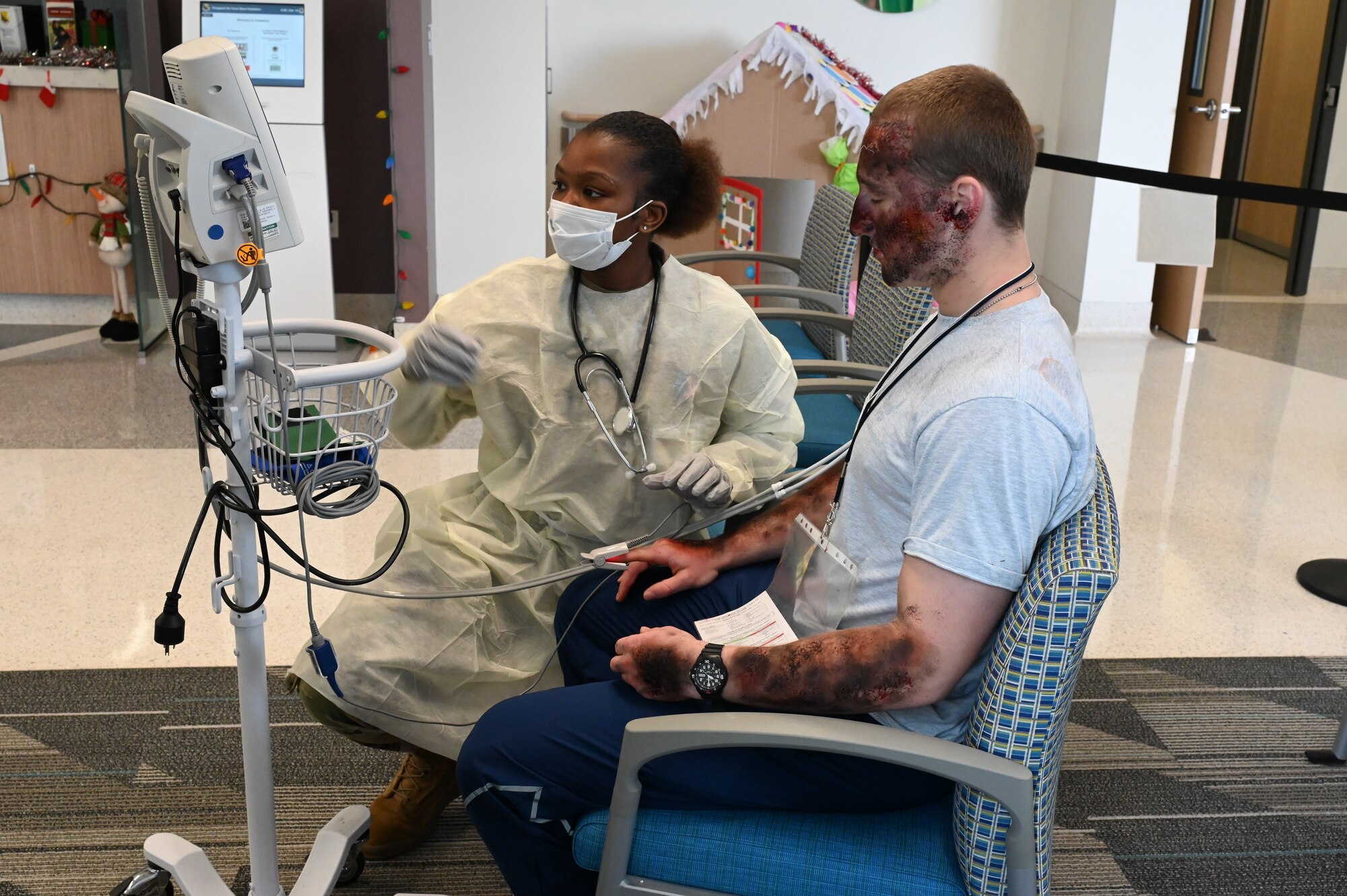 A patient receives an exam while sitting in the clinic.