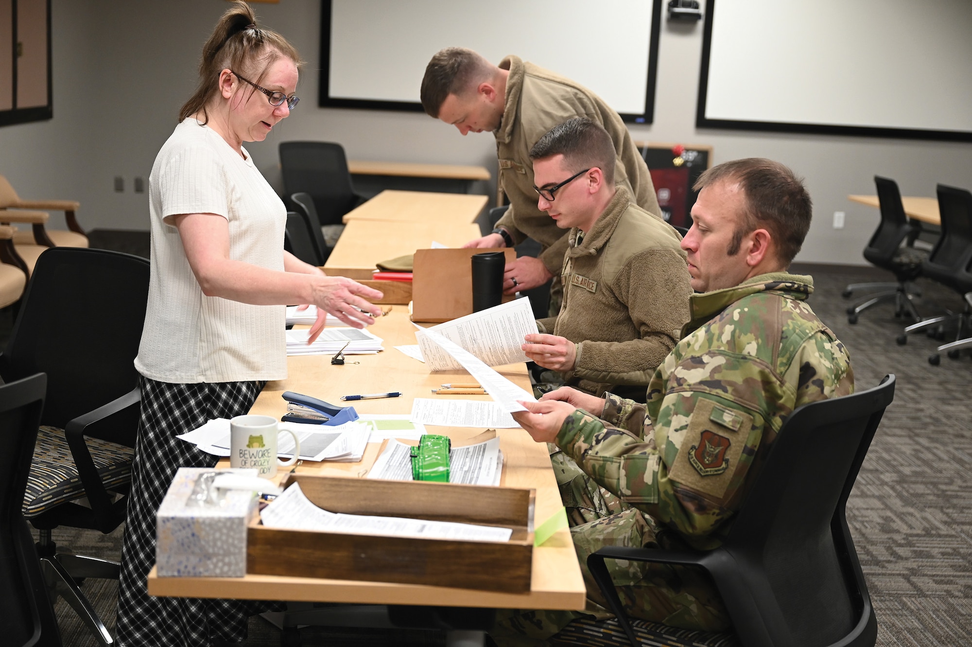Carrie Ruby, 445th Airlift Wing Financial Management Office budget analyst, assists wing Airmen during post-deployment in-processing at Wright-Patterson Air Force Base, Ohio, Jan. 5, 2024. The Airmen returned from a two-month deployment where they transported cargo,
personnel and humanitarian aid to various locations. (U.S. Air Force photo/Master Sgt. Patrick O’Reilly)