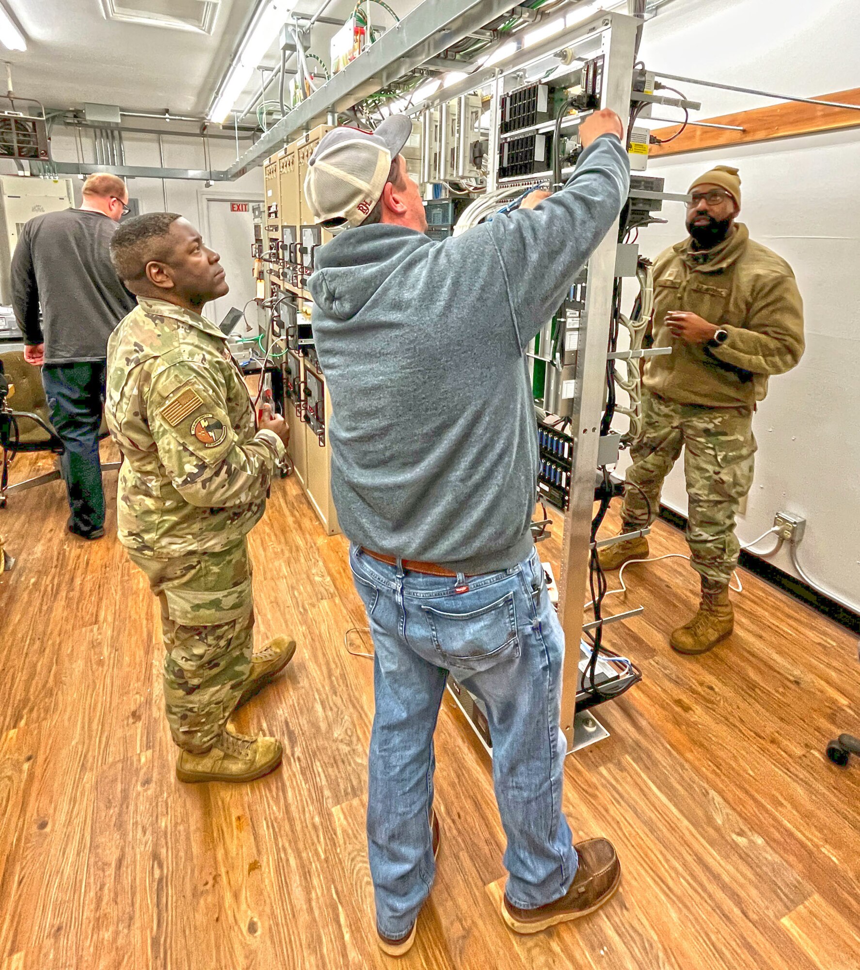 A man performing a radio inspection check.