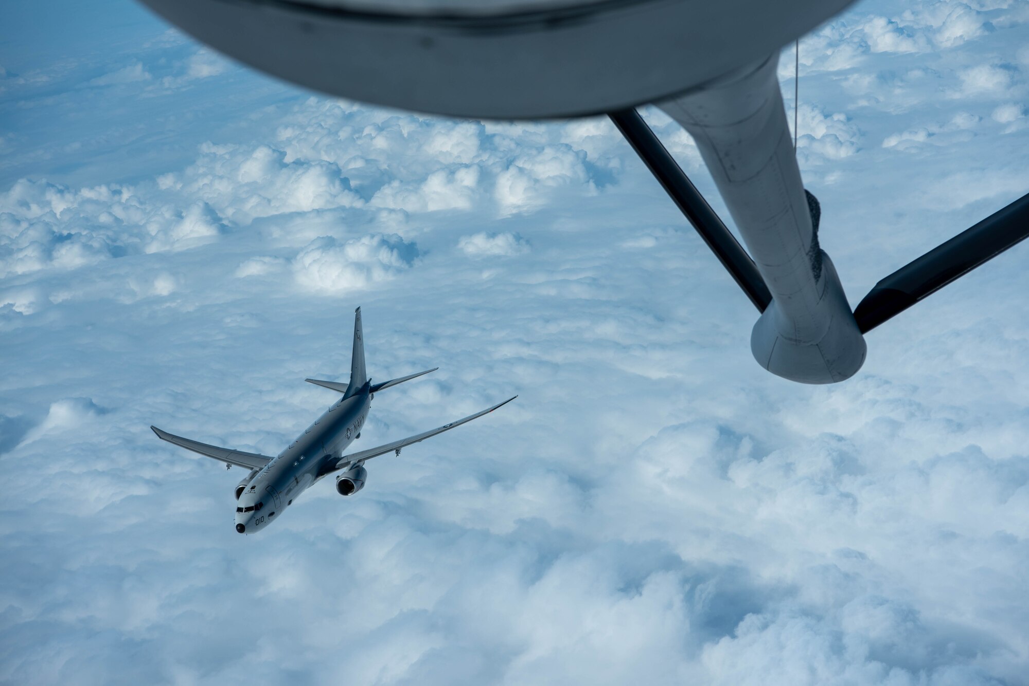 Plane flies away from a refueling plane