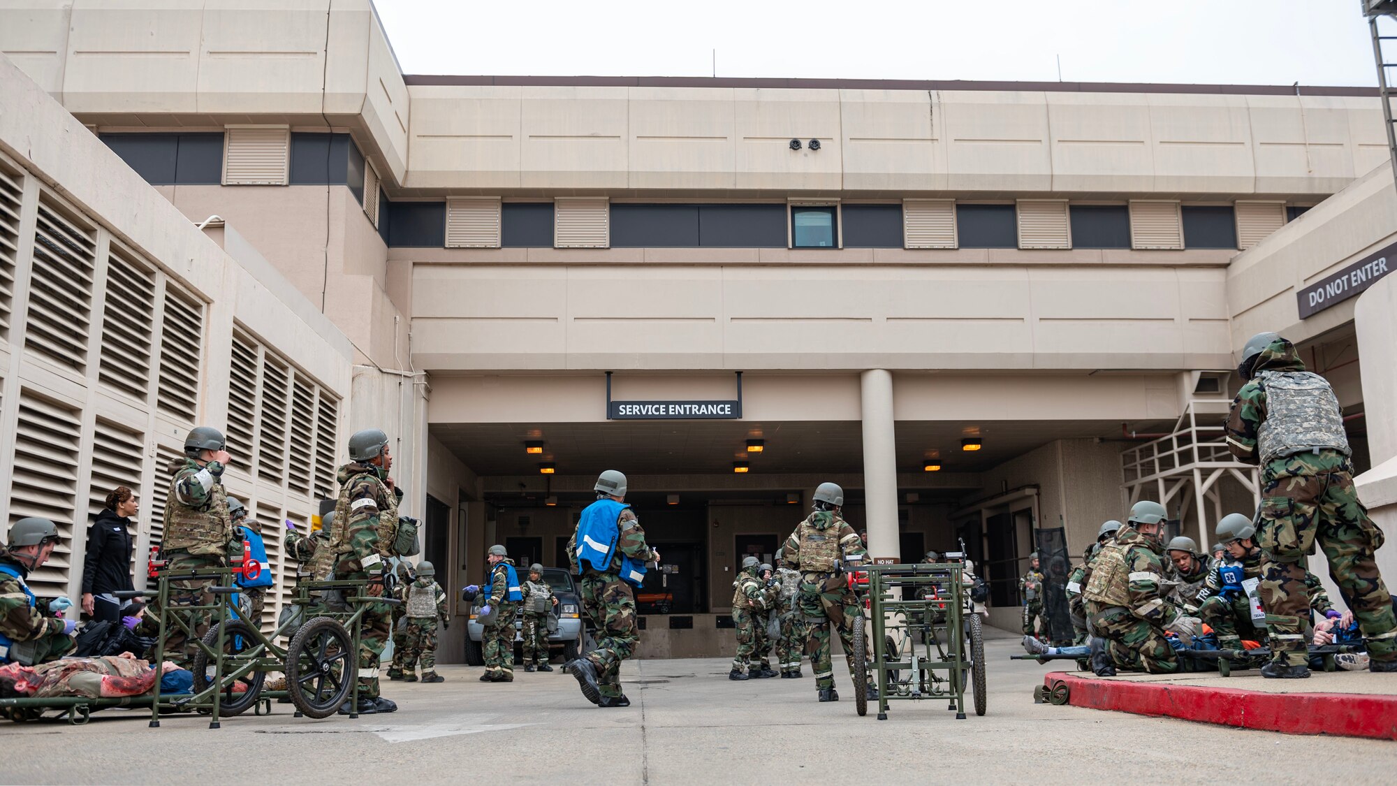 U.S. Air Force Airmen assigned to the 51st Medical Group participate in a mass casualty training event during Beverly Midnight 24-1 at Osan Air Base, Republic of Korea, Feb. 1, 2024. The mission of the 51st MDG is to maintain and ensure medical readiness for contingencies by providing high-quality, trusted care for approximately 8,000 enrollees and 20,000 beneficiaries. BM24-1 is a routine training event that tests the military capabilities across the peninsula, allowing combined and joint training at both the operational and tactical levels. (U.S. Air Force photo by Staff Sgt. Aubree Owens)