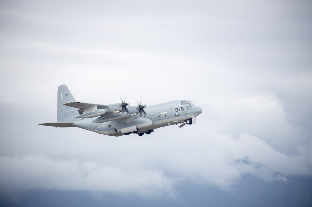 A KC-130 assigned to Marine Aerial Refueler Squadron 153 (VMGR-153), Marine Aircraft Group 24, 1st Marine Aircraft Wing, takes off during a forward arming and refueling point exercise (FARP) as part of Force Design Integration Exercise (FDIE) at Marine Corps Air Station Kaneohe Bay, Hawaii, Sept. 27, 2023. A FARP is used to extend the capabilities of rotary or fixed-wing aircraft to allow rearming and refueling without having to fall back to a forward operating base. (U.S. Marine Corps photo by Lance Cpl. Logan Beeney)