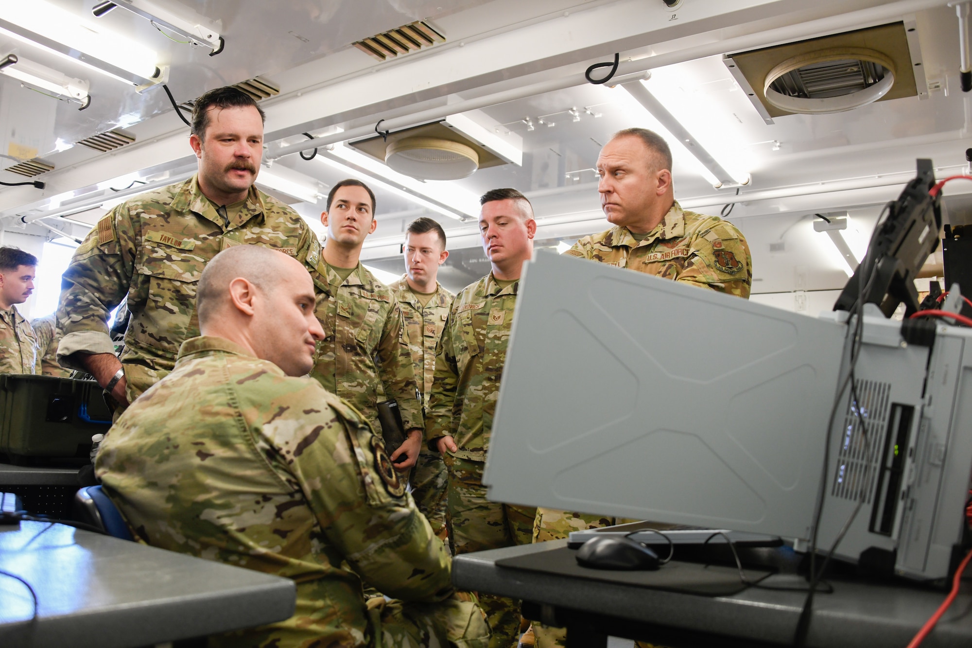 Airmen assigned to the 184th Regional Support Group; the 134th Air Control Squadron; the 284th Air Support Operations Squadron; and the 752nd Operations Support Squadron discuss the functionality and applications of the Tactical Operations Center – Light during a training collaboration at McConnell Air Force Base, Kansas, Jan. 29, 2024. The TOC-L is a new battle management system that is highly mobile, compact, and operates from anywhere on the battlefield.
(U.S. Air National Guard photo by Master Sgt. Matt McCoy)