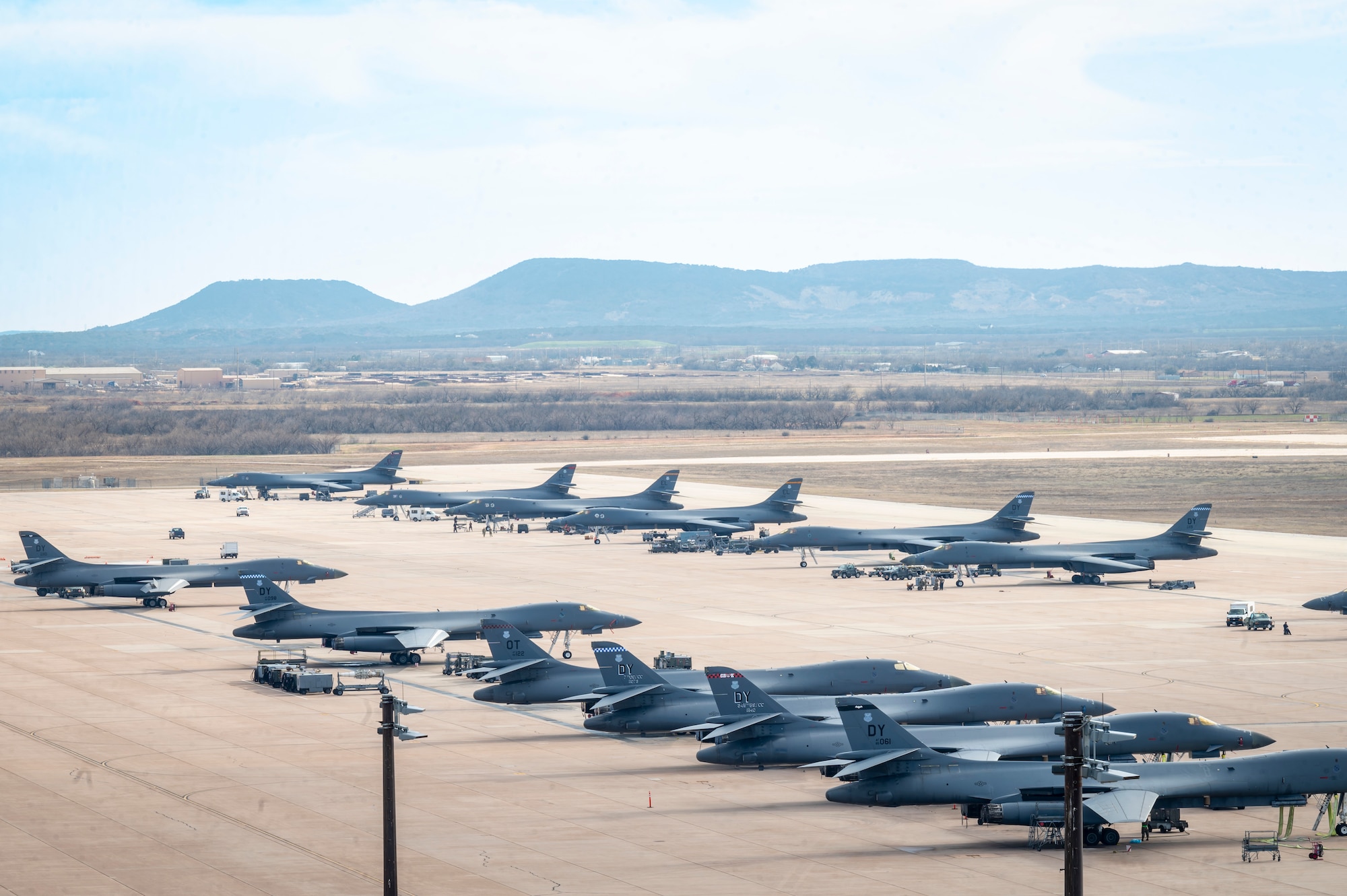 B-1B Lancers from Dyess and Ellsworth Air Force Base, South Dakota, sit on the flightline at Dyess Air Force Base, Texas, Feb. 1, 2024. Ellsworth Air Force Base B-1Bs recently launched from Dyess Air Force Base to support U.S. Central Command priorities, validating the United States Air Force capability to provide precision, long-range strike anytime, anywhere. (U.S. Air Force photo by Senior Airman Leon Redfern)