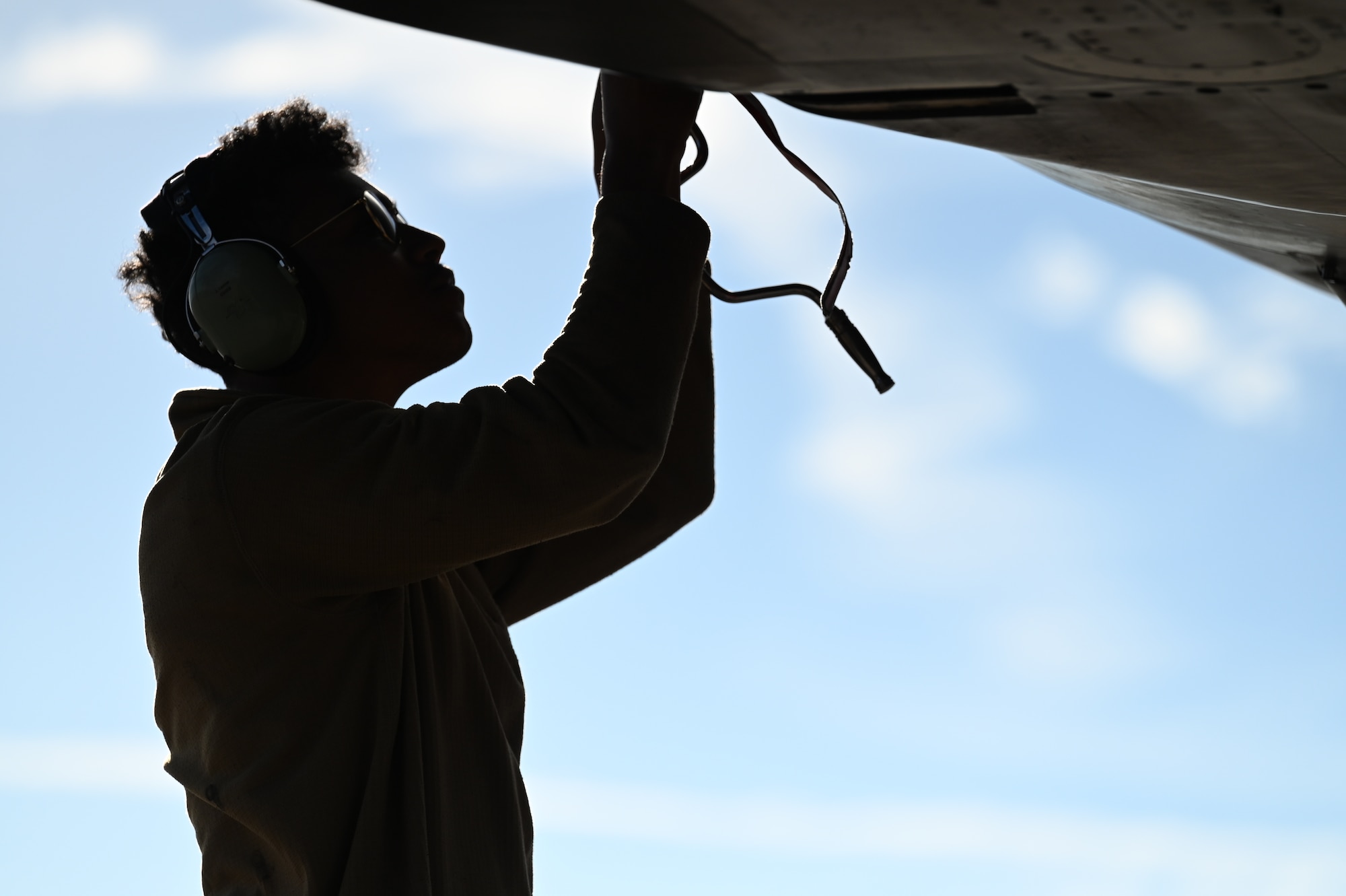 An Airman from the 28th Maintenance Group, Ellsworth Air Force Base, South Dakota, performs preflight maintenance on a B-1B Lancer on the flightline at Dyess AFB, Texas, Feb. 1, 2024. Ellsworth Air Force Base B-1Bs recently launched from Dyess Air Force Base to support U.S. Central Command priorities, validating the United States Air Force capability to provide precision, long-range strike anytime, anywhere. (U.S. Air Force photo by Staff Sgt. Holly Cook)