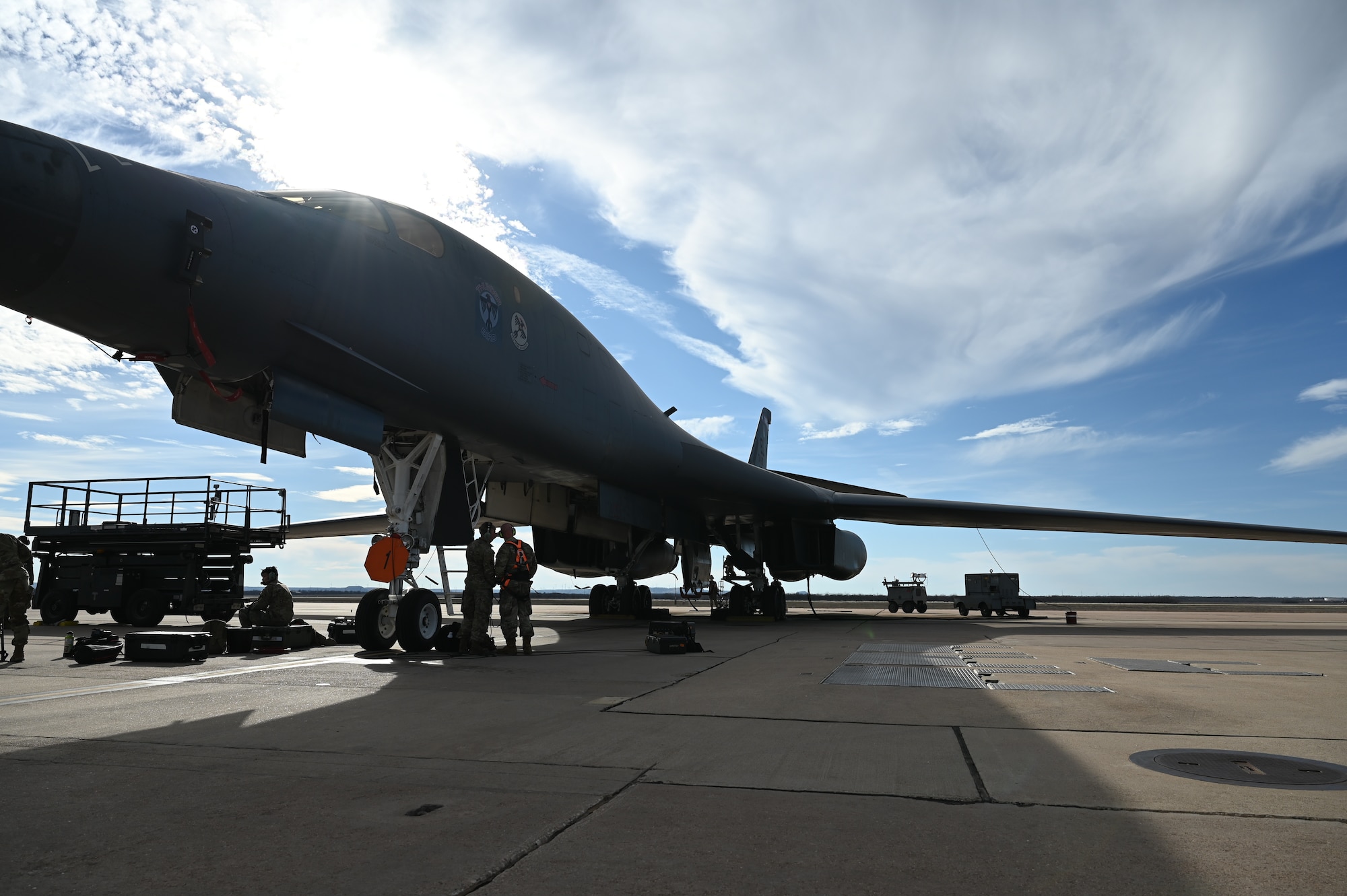Airmen from the 28th Maintenance Group, Ellsworth Air Force Base, South Dakota, and the 7th MXG perform preflight maintenance on a B-1B Lancer on the flightline at Dyess AFB, Texas, Feb. 1, 2024. Ellsworth Air Force Base B-1Bs recently launched from Dyess Air Force Base to support U.S. Central Command priorities, validating the United States Air Force capability to provide precision, long-range strike anytime, anywhere. (U.S. Air Force photo by Staff Sgt. Holly Cook)