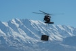 Utah Army and Air National Guardsmen particpate in a joint Exercise involving a mobile kitchen being connected to a UH-60 Black Hawk on January 31, 2024 at Camp Williams. Exercise PERSES  challenges the tactics, techniques, and procedures of both Utah Air and Army National Guard units along with other component units, while testing innovative ideas and communication practices. (U.S. Air Force photo by Airman First Class Kyle Blackham)