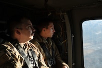 Airman flying in Helicopter
