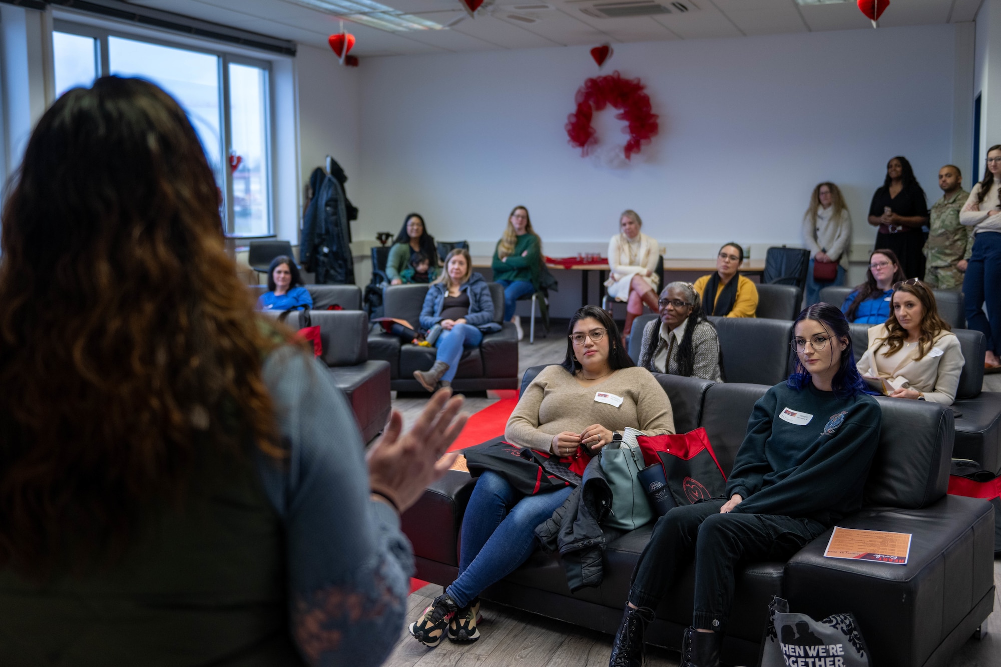 Military spouses listen as a key spouse speaks during a Heart Link workshop at Spangdahlem Air Base, Germany, Jan. 31, 2024.