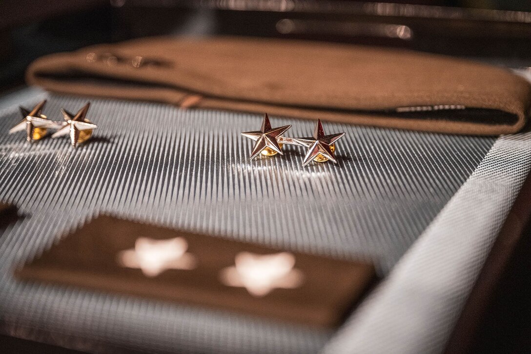 Two sets of double stars for a uniform sit on a surface.