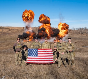 U.S. Navy Explosive Ordnance Disposal (EOD) Technicians assigned to Explosive Ordnance Disposal Group (EODGRU) 2 and U.S. Air Force EOD Technicians assigned to the 148th Fighter Wing EOD Flight pose for a photo as part of Snow Crab Exercise 24-1. SNOWCRABEX is an annual exercise designed to test and evaluate U.S. Navy EOD and Navy Diver’s capabilities and equipment in a simulated arctic environment and improve combat effectiveness. Navy EOD and Navy Divers are part of the Navy Expeditionary Combat Force (NECF), enabling the U.S. Navy Fleet by clearing and protecting the battlespace. (U.S. Navy Photo by Mass Communication Specialist 1st Class Jacob D. Bergh/Released)