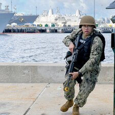 LS2 Juan Bautista, assigned to USS Boxer (LHD 4), responds during an anti-terrorism force protection drill at Naval Base San Diego.