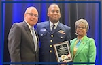 Lt. Andre Jones Butler with Coast Guard Vice Admiral (ret.) Manson Brown and Ms. Barbara Ward, Co-Chair, NAACP Armed Services & Veterans Affairs Committee, at the NAACP National Convention awards ceremony, Boston, MA.