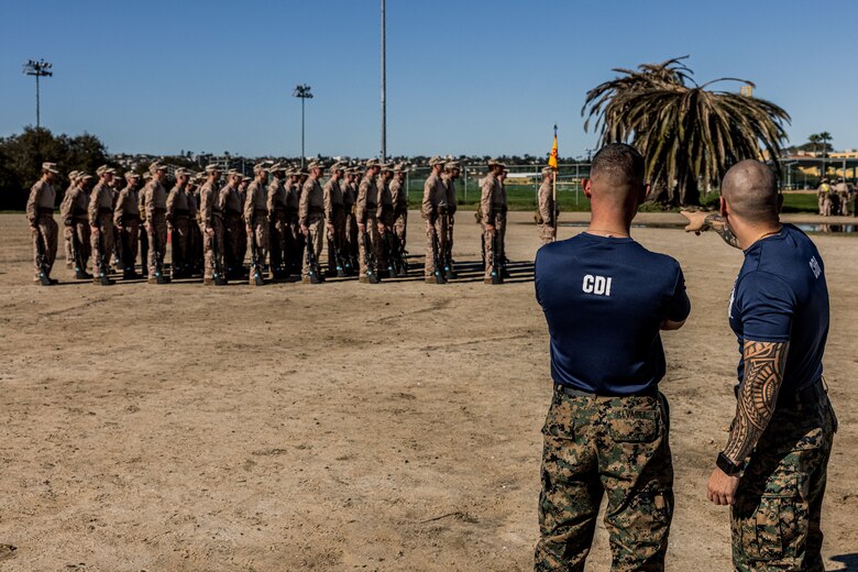 U.S. Marine Corps chief drill instructors with Mike Company, 3rd Recruit Training Battalion, observe recruits after a Marine Corps Martial Arts Program training event at Marine Corps Recruit Depot San Diego, Jan. 29, 2024. MCMAP aims to strengthen the mental and moral resiliency of individual recruits and Marines through realistic combative training, warrior ethos studies, and physical hardening. (U.S. Marine Corps photo by Lance Cpl. Jacob B. Hutchinson)
